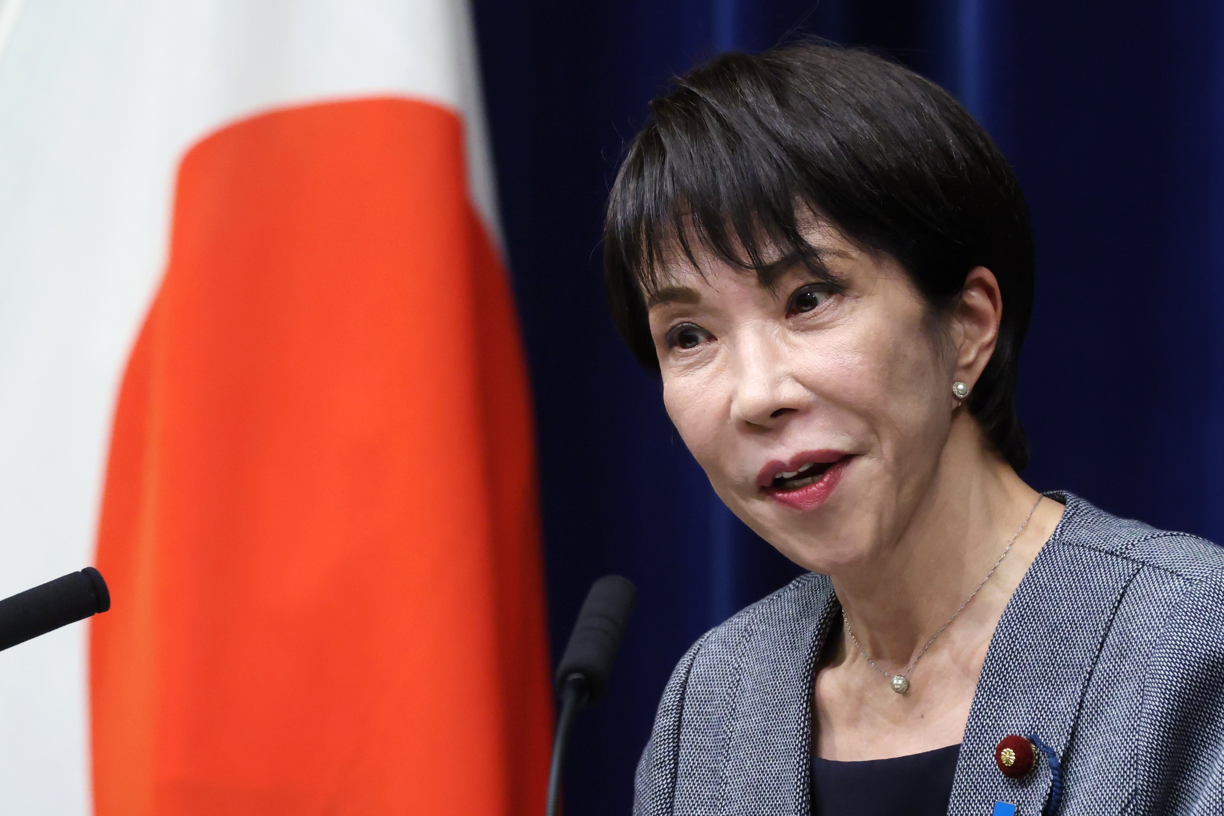 Japan's Prime Minister Sanae Takaichi speaking at a press conference after the passage of Japan's Hinomaru flag desecration law