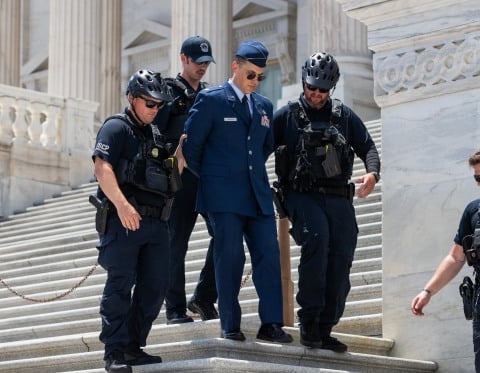 US Capitol Police arrest Air Force Major Jason Watson on Capitol steps during Trump impeachment protest