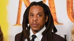Jay-Z performing at a packed venue during his sold-out Yankee Stadium residency whose final night was disrupted by a security breach that drew an NYPD response