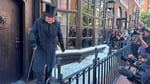 Johnny Depp in full Ebenezer Scrooge costume with nose prosthetic, black cape and top hat at the Paramount activation at San Diego Comic-Con 2026