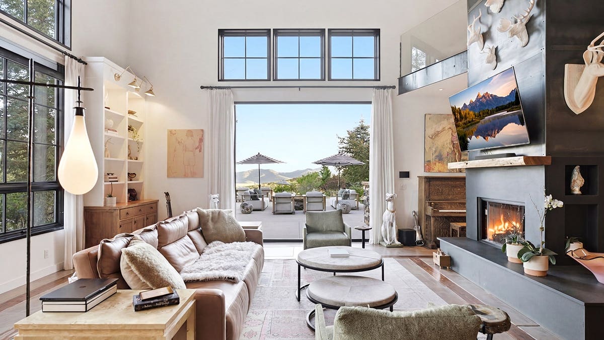 Interior living room of Katherine Heigl and Josh Kelley's Oakley, Utah estate featuring mountain-view windows and open-plan design