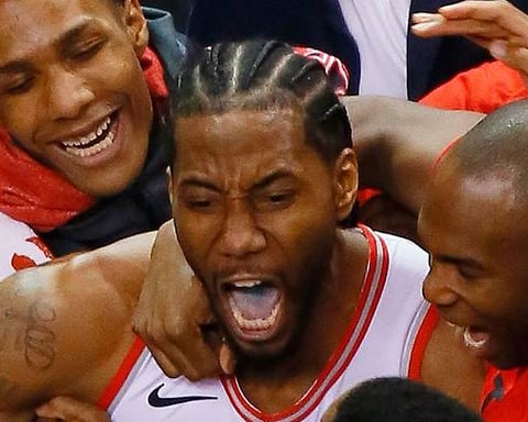 Kawhi Leonard and the Raptors celebrate his series-clinching shot in the 2019 NBA playoffs