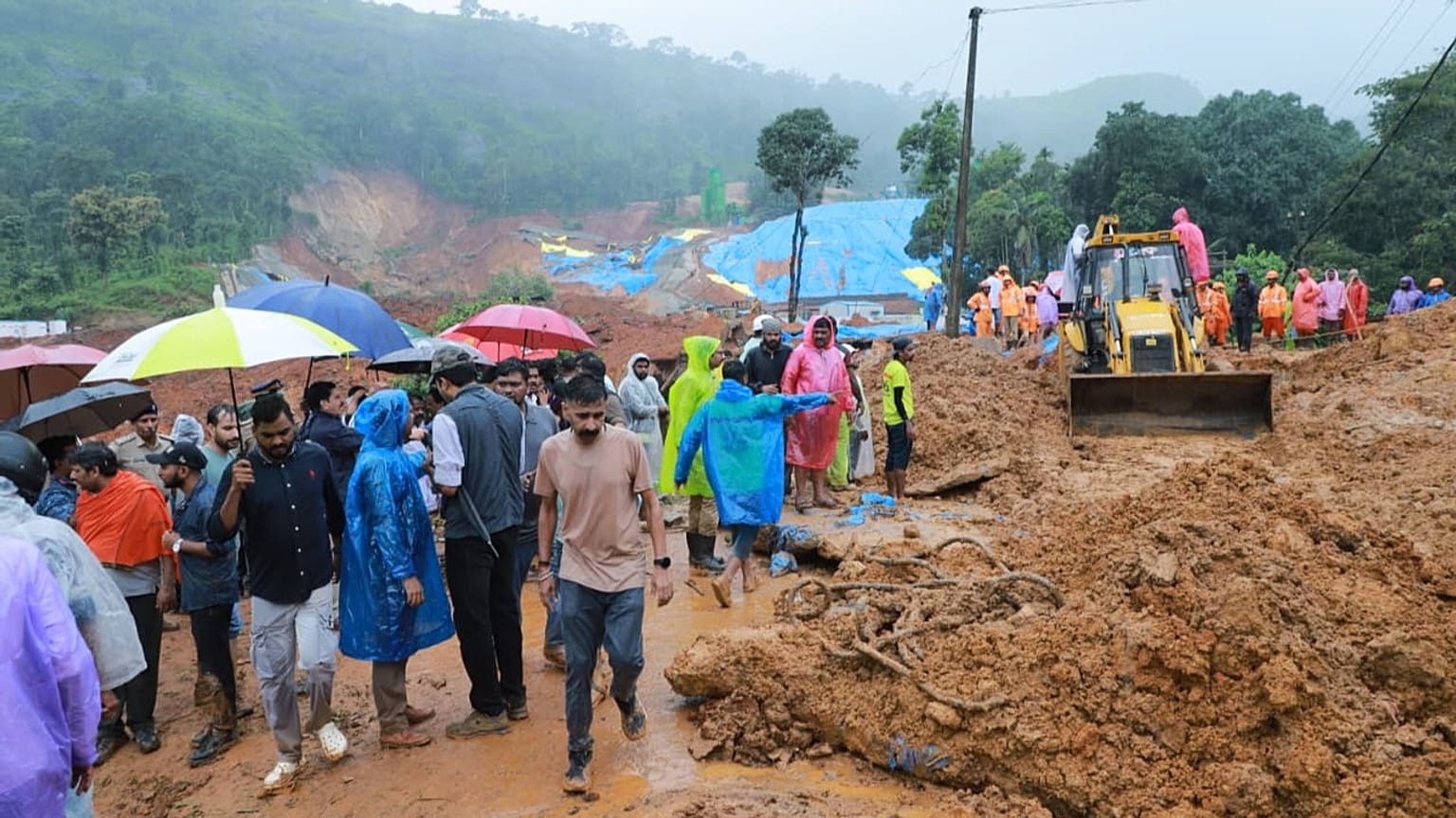 Rescue workers search through mud and debris at the Meppadi tunnel construction site in Wayanad, Kerala