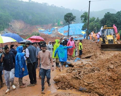 Rescue workers search through mud and debris at the Meppadi tunnel construction site in Wayanad, Kerala