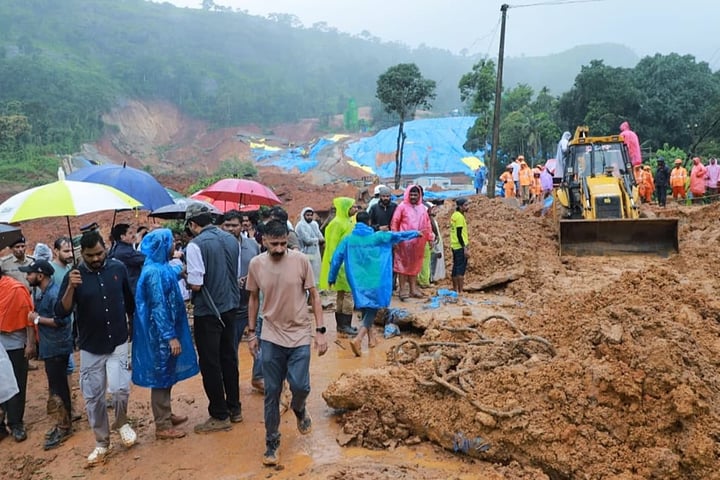 Rescue workers search through mud and debris at the Meppadi tunnel construction site in Wayanad, Kerala