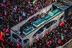 Millions of Iranian mourners at the Imam Reza shrine in Mashhad for Ayatollah Khamenei's funeral carrying red flags of vengeance