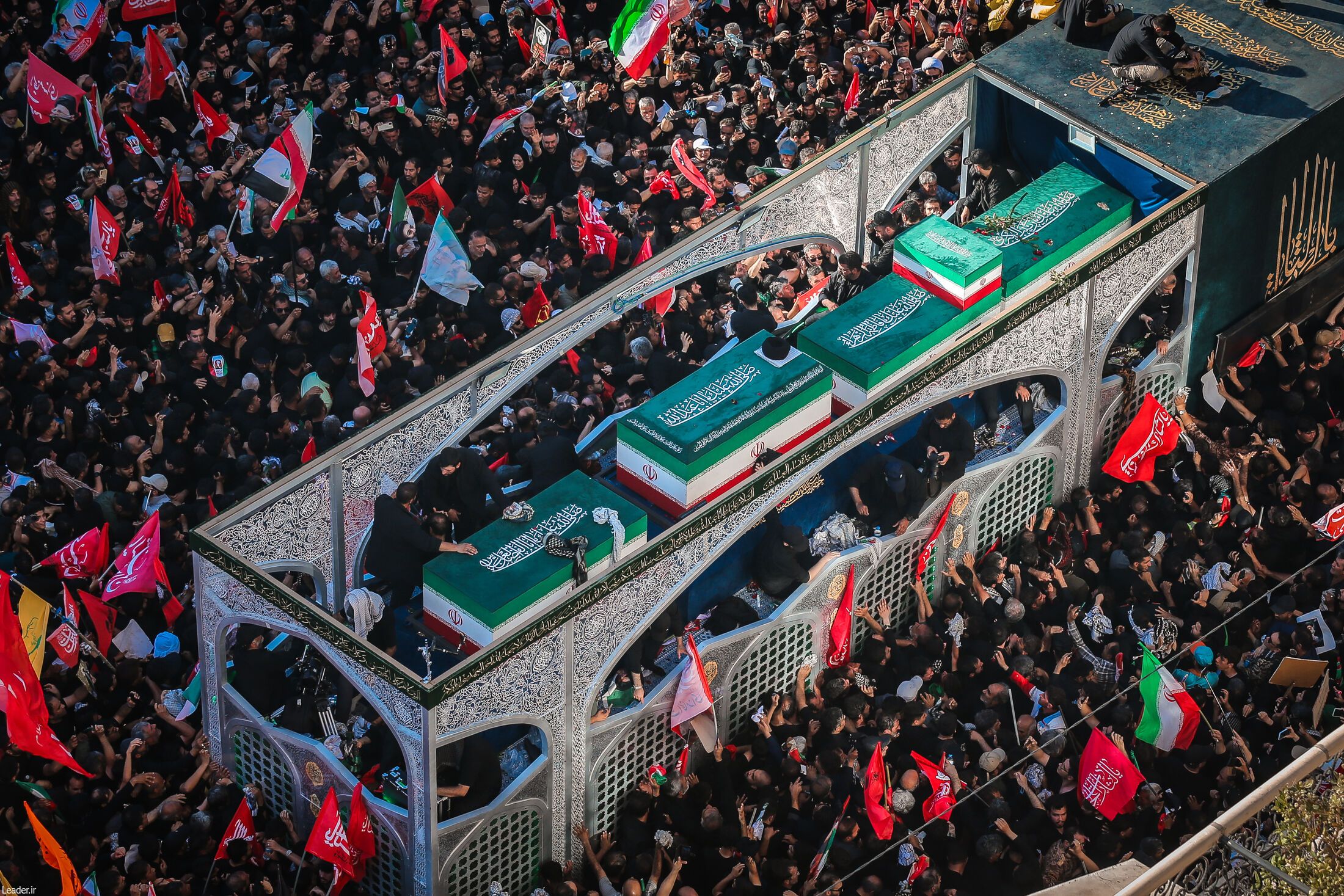 Millions of Iranian mourners at the Imam Reza shrine in Mashhad for Ayatollah Khamenei's funeral carrying red flags of vengeance