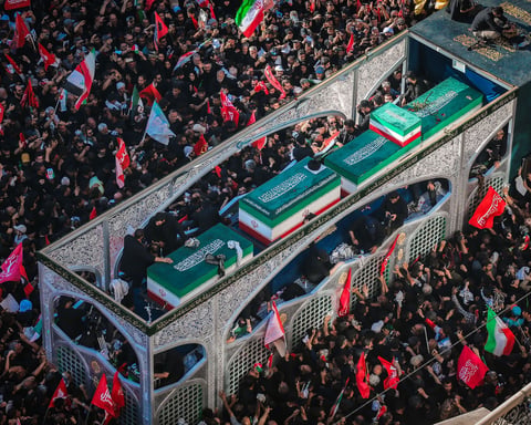 Millions of Iranian mourners at the Imam Reza shrine in Mashhad for Ayatollah Khamenei's funeral carrying red flags of vengeance