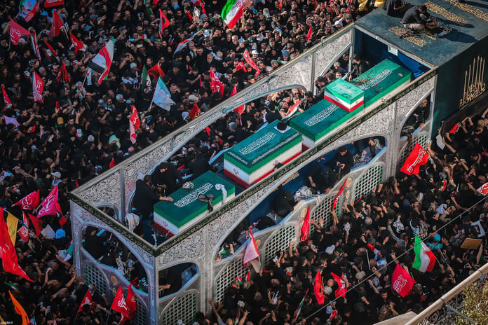 Millions of Iranian mourners at the Imam Reza shrine in Mashhad for Ayatollah Khamenei's funeral carrying red flags of vengeance