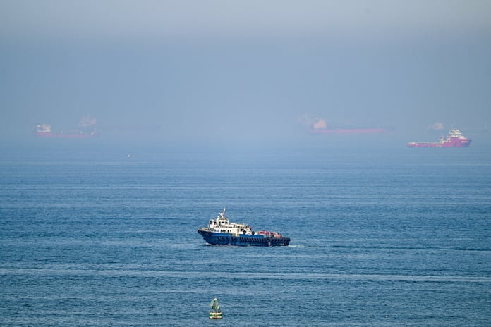 Cargo ships off Khor Fakkan Container Terminal UAE Gulf of Oman Strait of Hormuz June 2026