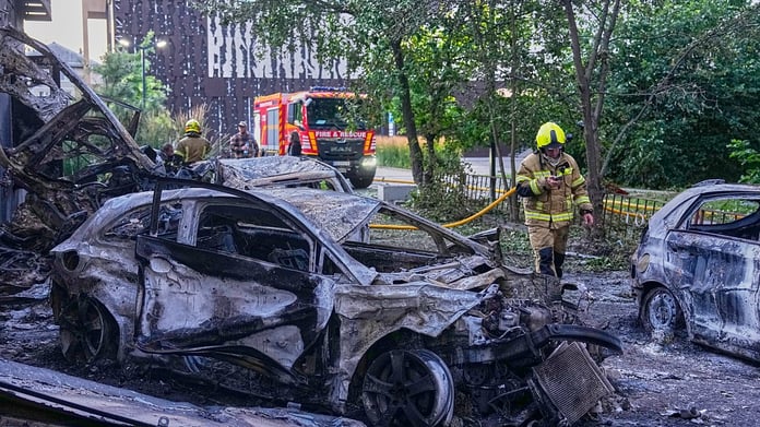 Firefighters extinguish fires in Kyiv residential building struck by Russian ballistic missiles in largest barrage of the conflict