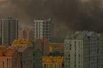 Smoke and flames rise over a Kyiv residential district during Russia's predawn ballistic missile barrage on July 11 2026