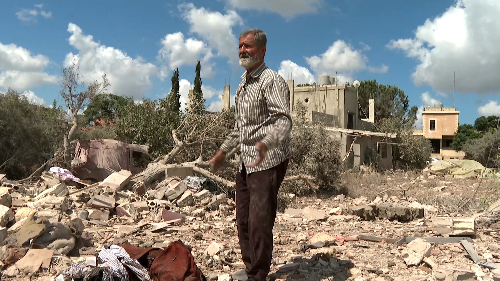 Lebanese civilians survey destroyed homes in southern Lebanon after Israeli military operations during post-ceasefire occupation