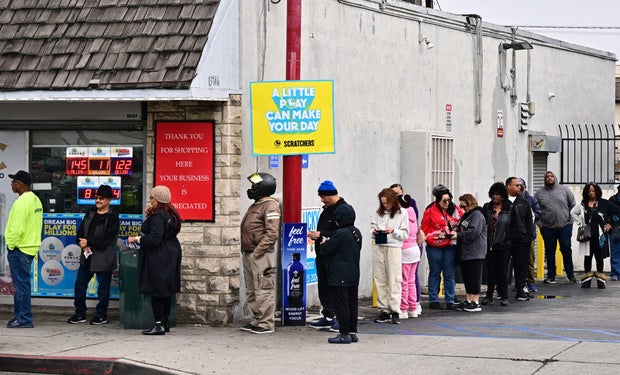 People purchasing Mega Millions lottery tickets at a California store