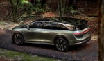Lucid Gravity SUV parked in a forest setting