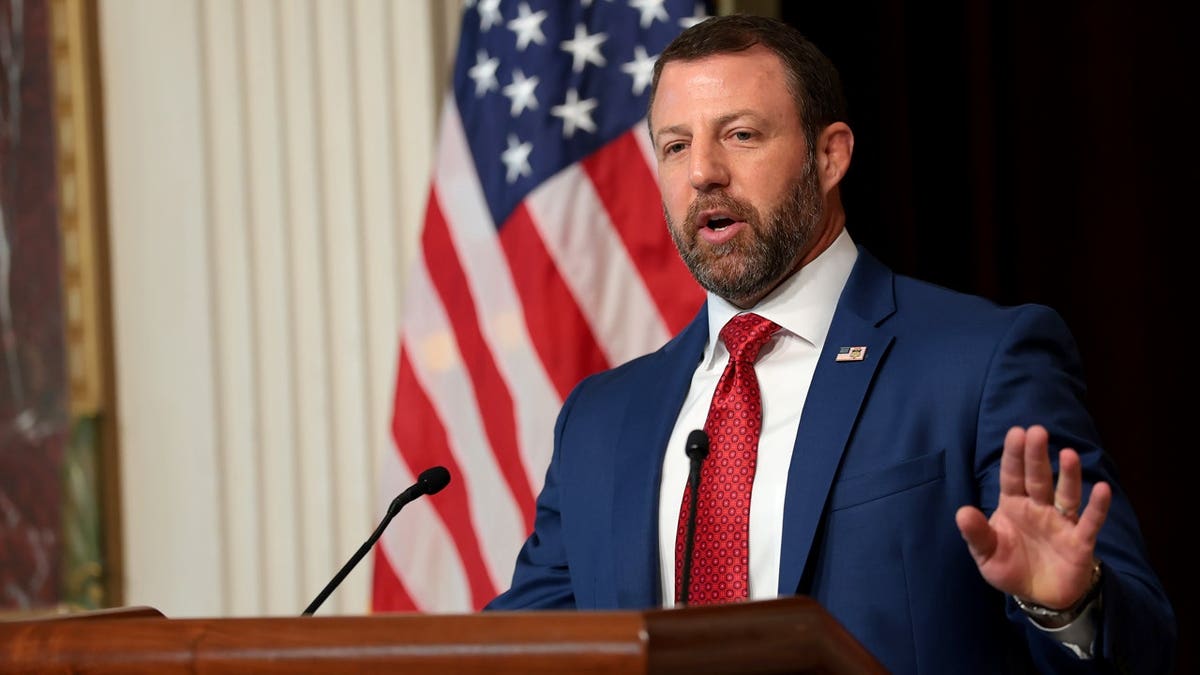 DHS Secretary Markwayne Mullin at a press conference announcing election security measures and voter roll compliance requirements