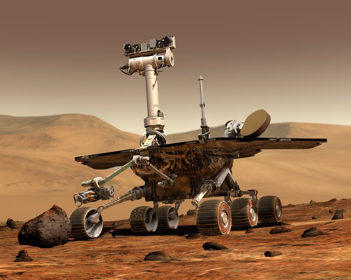 An artist's concept illustration of a NASA rover exploring the surface of Mars