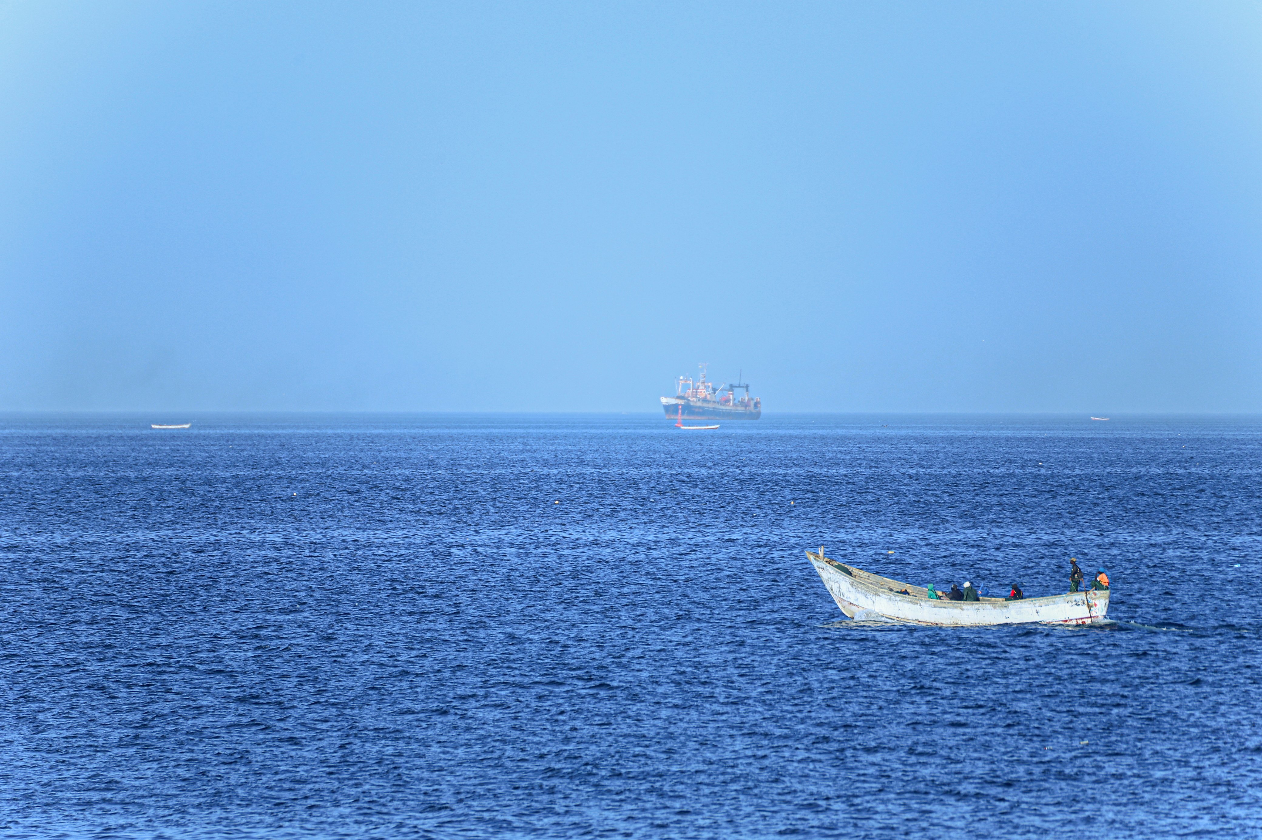 Fishing boats at sea near Nouadhibou Mauritania where Gambian migrants were rescued after 25 days adrift on the Atlantic route to the Canary Islands