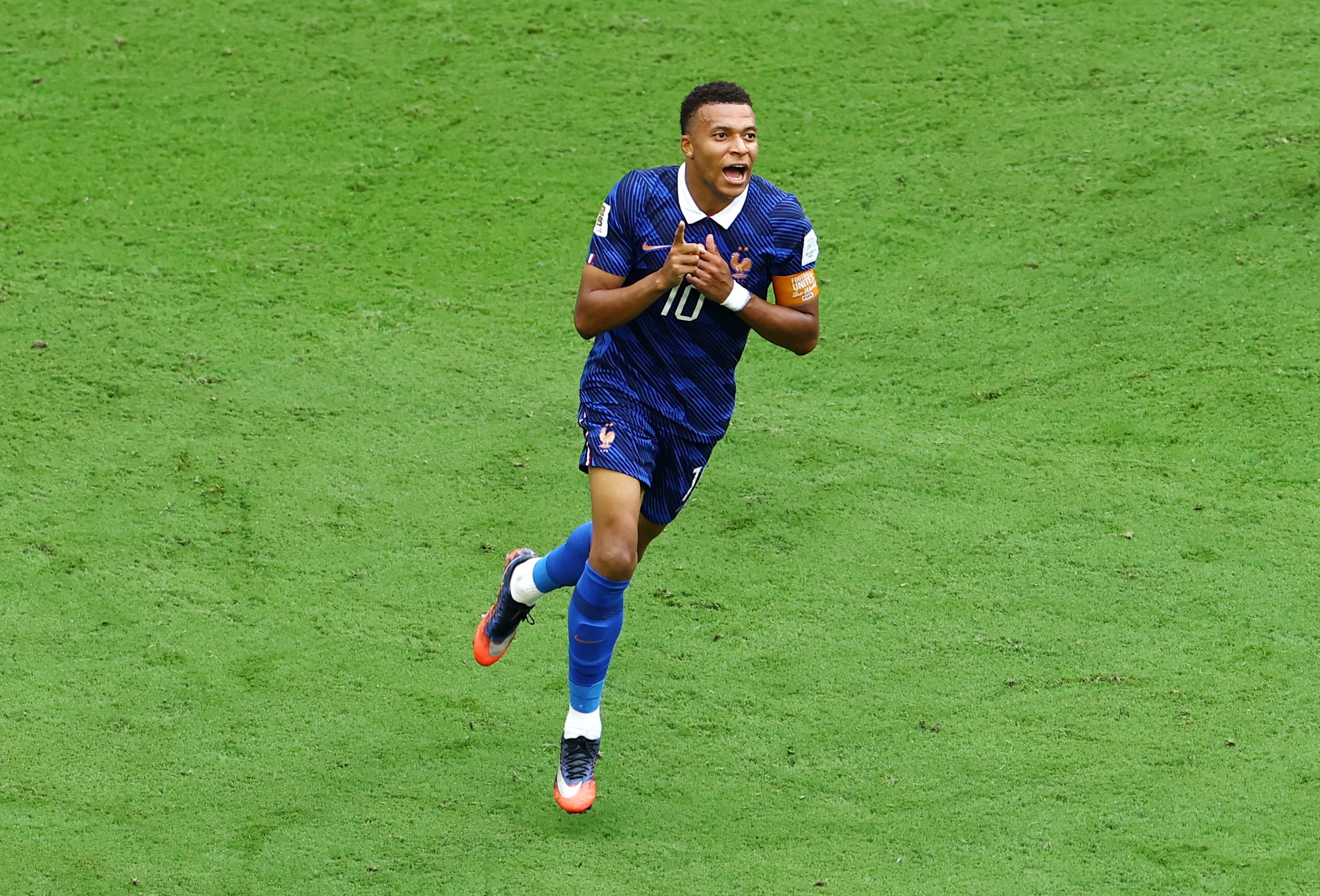 Kylian Mbappe celebrates after scoring his 22nd World Cup goal breaking the all-time record against England in Miami