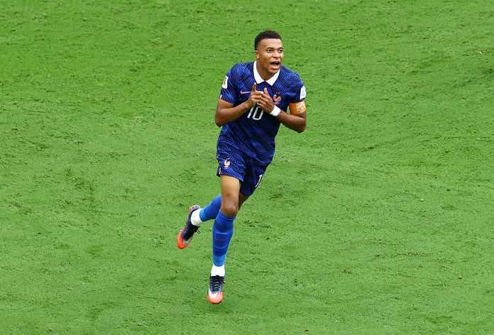 Kylian Mbappe celebrates after scoring his 22nd World Cup goal breaking the all-time record against England in Miami