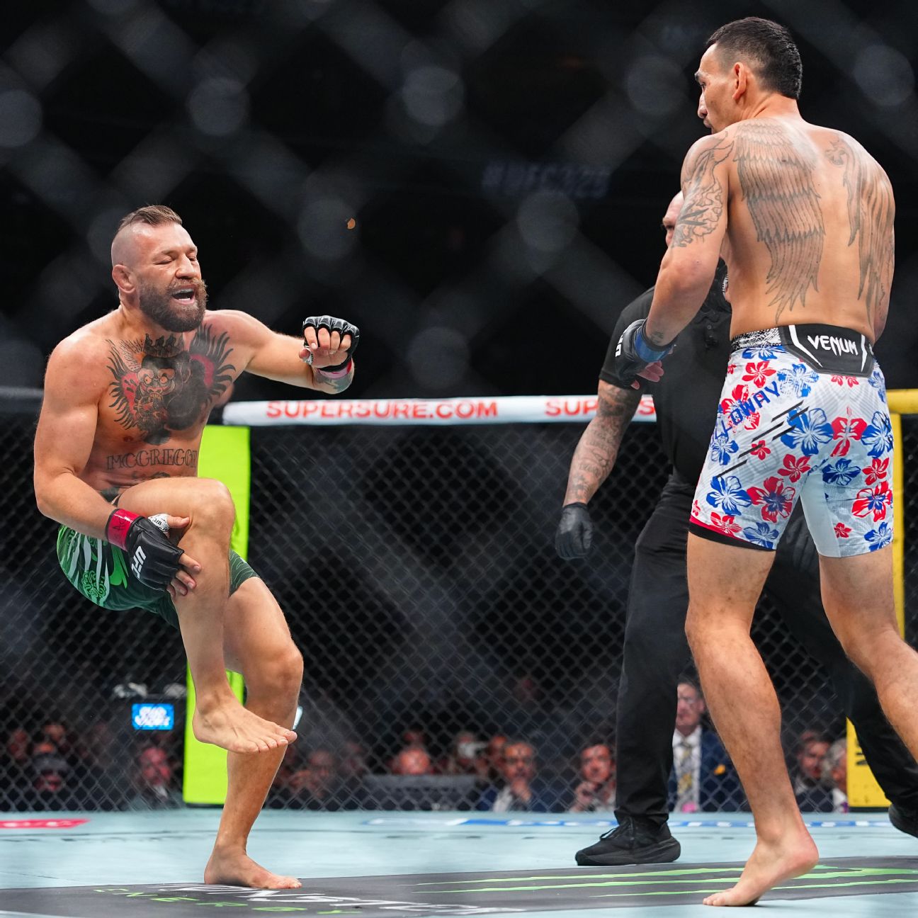 Max Holloway defeats Conor McGregor by TKO as referee Mike Beltran stops the UFC 329 main event