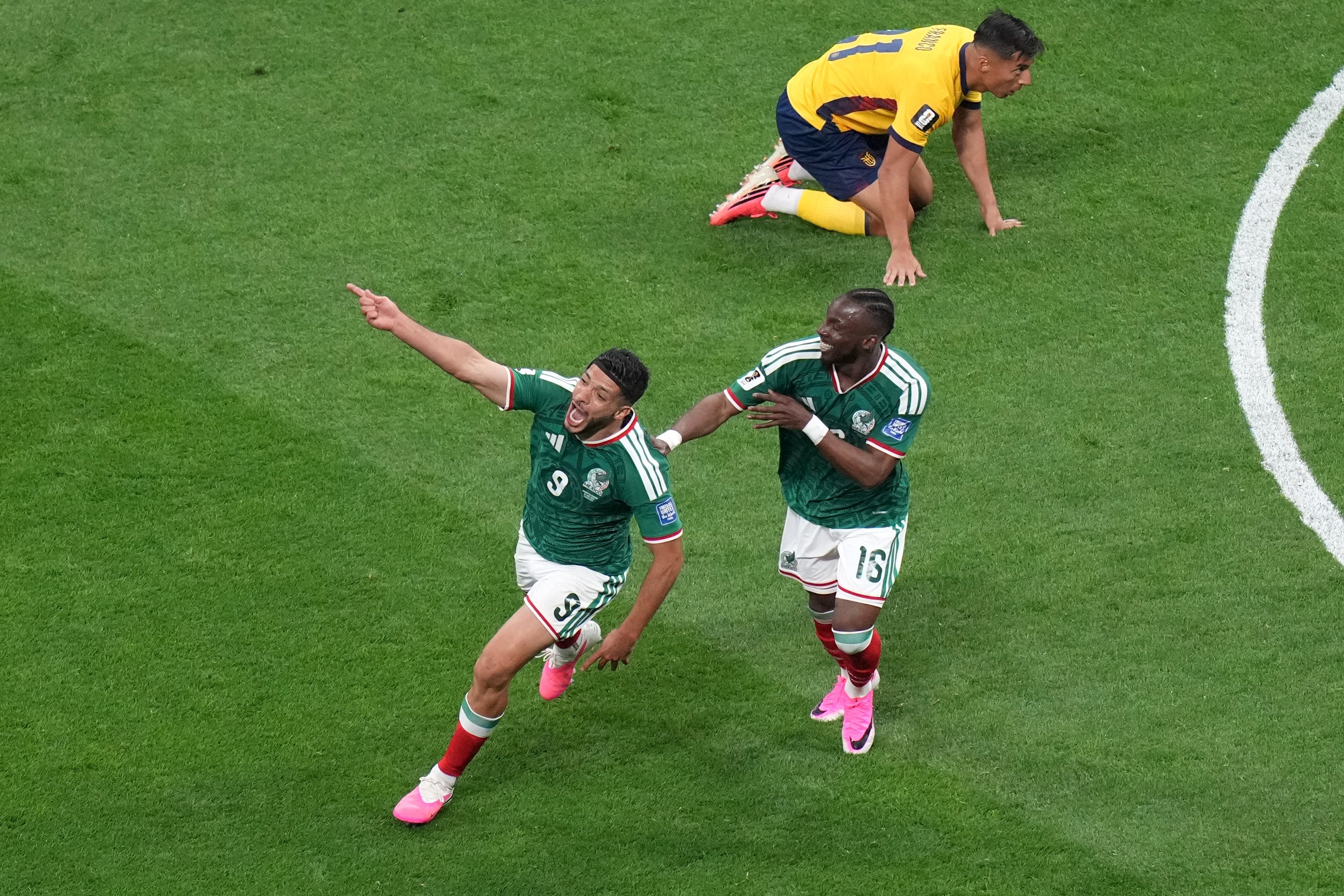 Raúl Jiménez and Julián Quiñones celebrate Mexico's 2-0 win over Ecuador at Estadio Azteca in World Cup 2026 round of 32