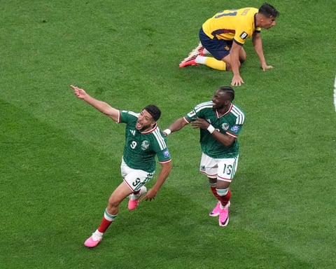 Raúl Jiménez and Julián Quiñones celebrate Mexico's 2-0 win over Ecuador at Estadio Azteca in World Cup 2026 round of 32