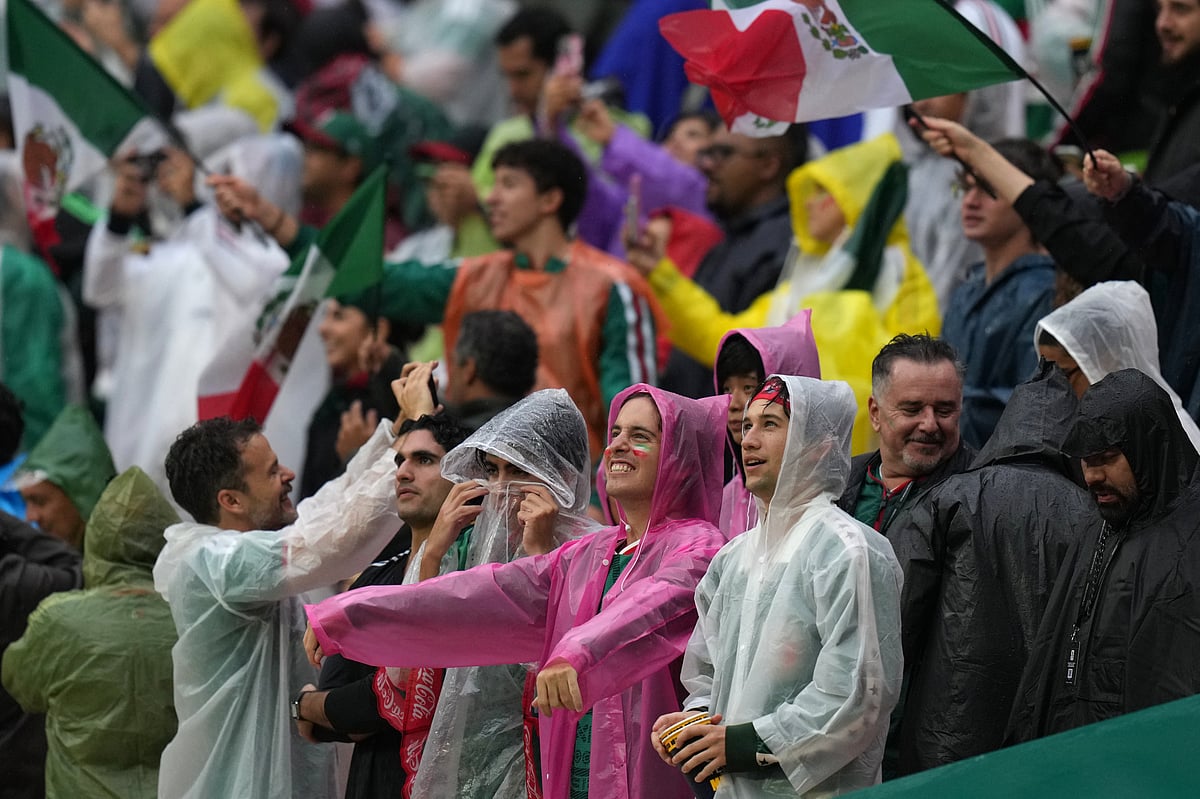Mexico supporters wait in the rain at Estadio Azteca before the England vs Mexico FIFA World Cup 2026 Round of 16