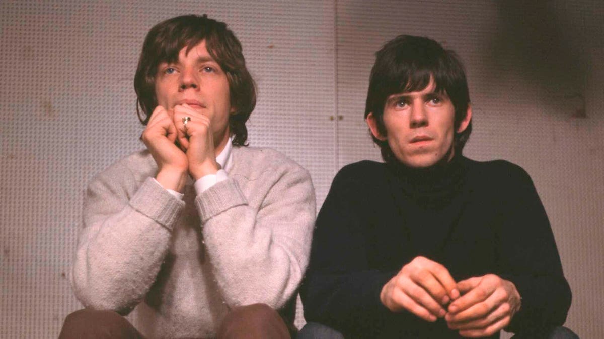 Mick Jagger and Keith Richards performing together on stage Rolling Stones