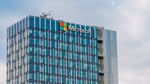 Microsoft logo with EU flag representing the company's EU Country-by-Country tax report revealing Ireland profit concentration
