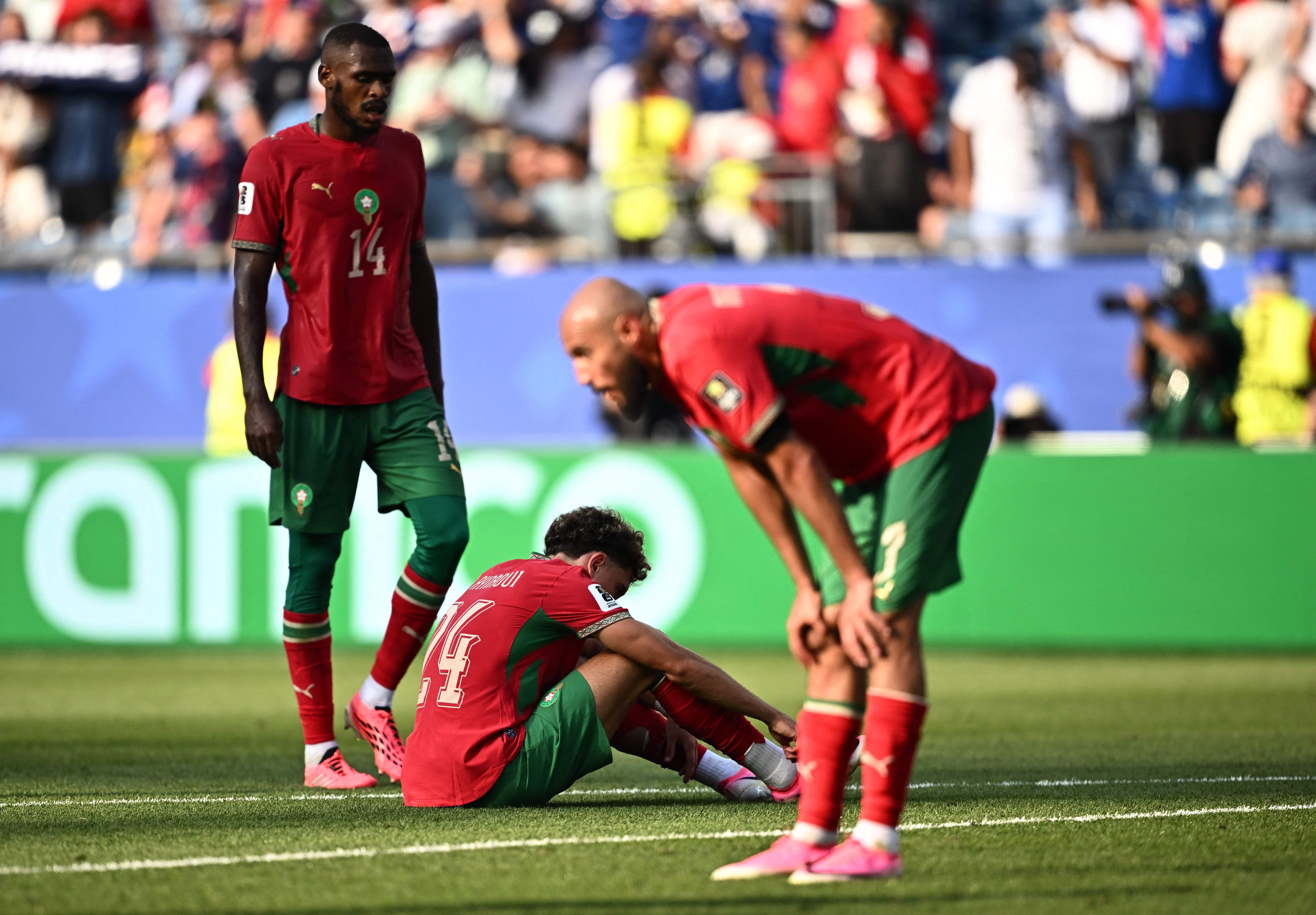 Morocco players react after being eliminated 2-0 by France in World Cup 2026 quarterfinal in Boston