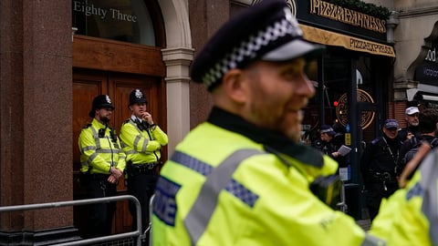 Police officers on London street during NCA Project Medusa investigation into organised drug-facilitated sexual assault network