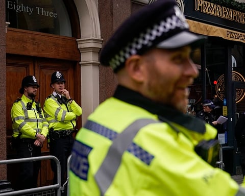 Police officers on London street during NCA Project Medusa investigation into organised drug-facilitated sexual assault network