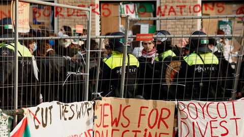 Pro-Palestinian demonstrators at the University of Amsterdam as the Netherlands moved to ban Israeli settlement imports