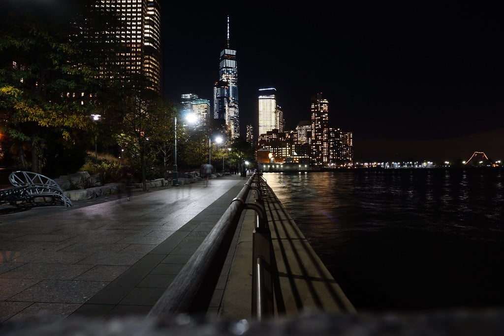 New York City skyline at night with One World Trade Center, site of the Kalshi illegal gambling lawsuit