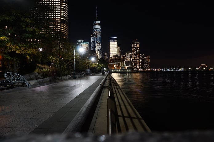 New York City skyline at night with One World Trade Center, site of the Kalshi illegal gambling lawsuit
