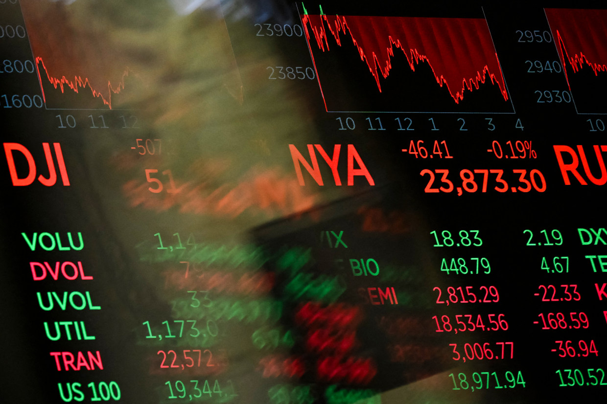 Digital screens display trading numbers on the floor of the New York Stock Exchange during the semiconductor bear market selloff