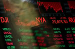 Digital screens display trading numbers on the floor of the New York Stock Exchange during the semiconductor bear market selloff
