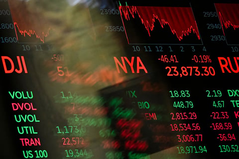 Digital screens display trading numbers on the floor of the New York Stock Exchange during the semiconductor bear market selloff