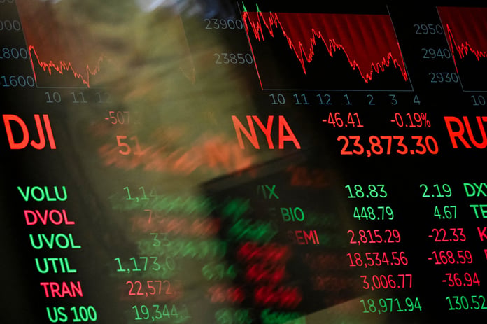 Digital screens display trading numbers on the floor of the New York Stock Exchange during the semiconductor bear market selloff