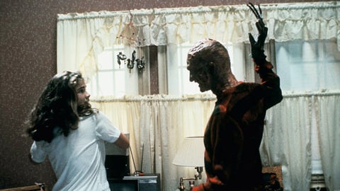 Robert Englund as Freddy Krueger alongside Heather Langenkamp in the 1984 original A Nightmare on Elm Street
