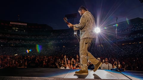 Noah Kahan performing at Fenway Park during The Great Divide Tour in July 2026