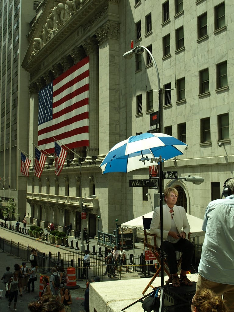 NYSE trading floor with traders and market screens representing Goldman Sachs private markets platform