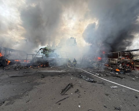 Firefighters extinguish a fire after a Russian strike on Odessa on July 13, 2026.