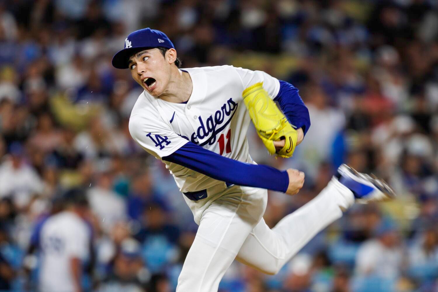 Shohei Ohtani watching from the Dodgers dugout in 2026