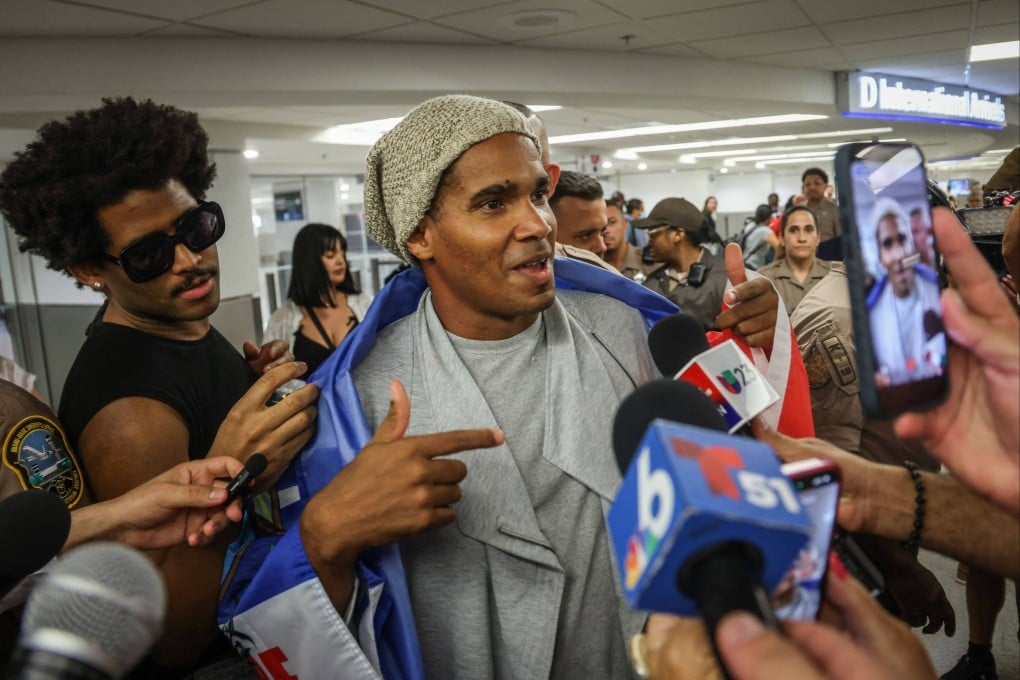 Cuban dissident artist Luis Manuel Otero Alcantara speaks to the press upon his arrival at Miami International Airport after five years in prison