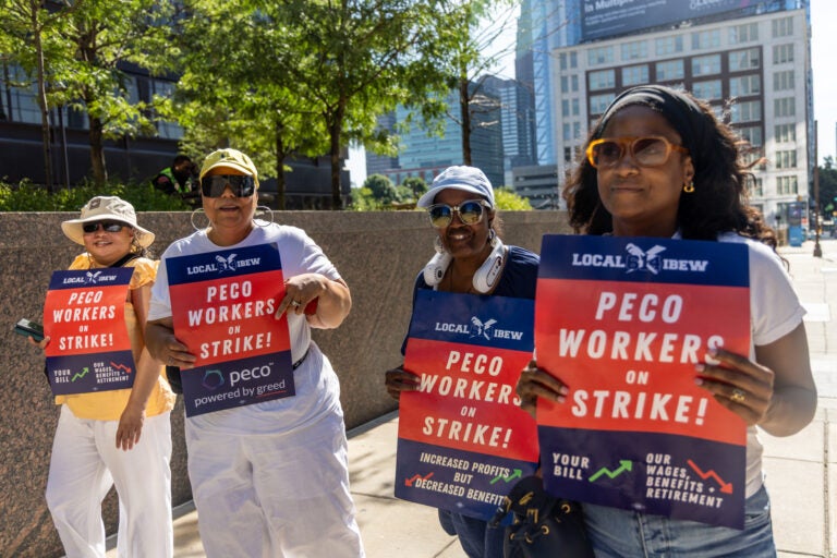 Striking PECO workers picket outside the company headquarters in Philadelphia