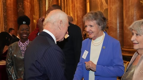 Dame Penelope Keith shaking hands with King Charles III at Buckingham Palace in November 2024, one of her final public appearances