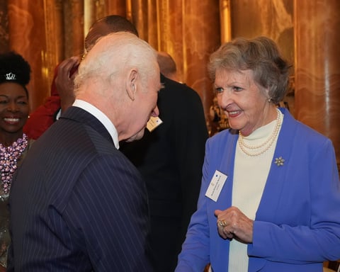 Dame Penelope Keith shaking hands with King Charles III at Buckingham Palace in November 2024, one of her final public appearances