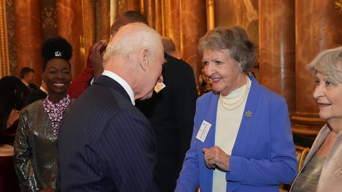 Dame Penelope Keith shaking hands with King Charles III at Buckingham Palace in November 2024, one of her final public appearances